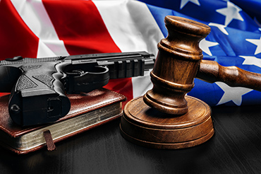370-gavel-on-wooden-table-with-usa-flag-2025-02-25-18-02-33-utc